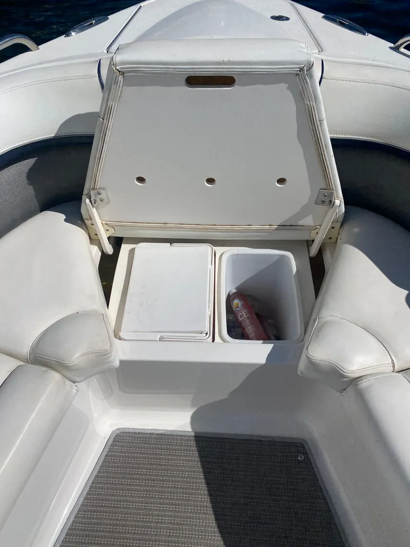 Slide: The Image of 2016 Formula 350 Crossover Bowrider with open storage compartment and seating area. - 11
