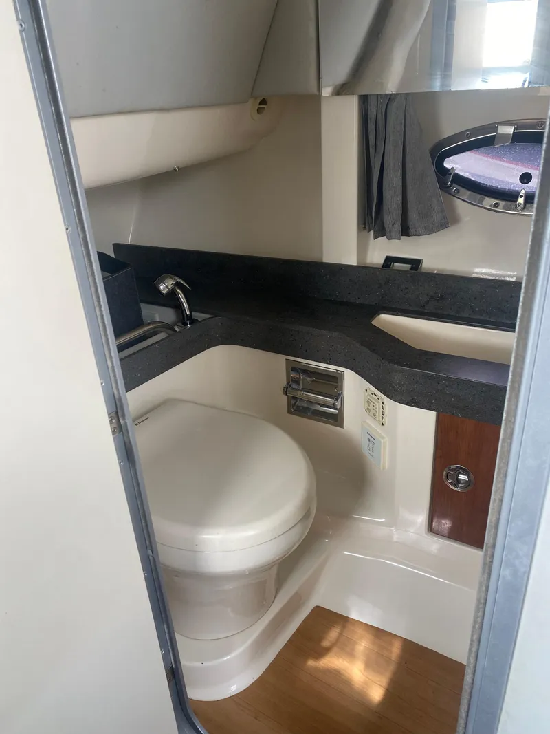 Slide: The Image of 2016 Formula 350 Crossover Bowrider bathroom with modern fixtures and compact design. - 28