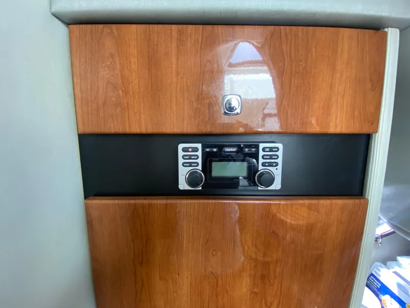 Slide: The Image of 2016 Formula 350 Crossover Bowrider interior with wood paneling and stereo system. - 29