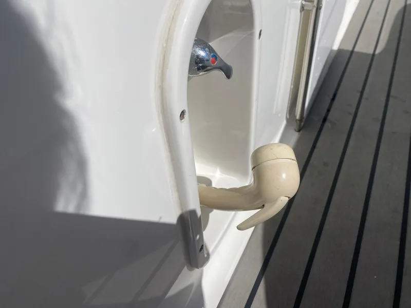 Slide: The Image of 2016 Formula 350 Crossover Bowrider boat detail with handle and deck view. - 9