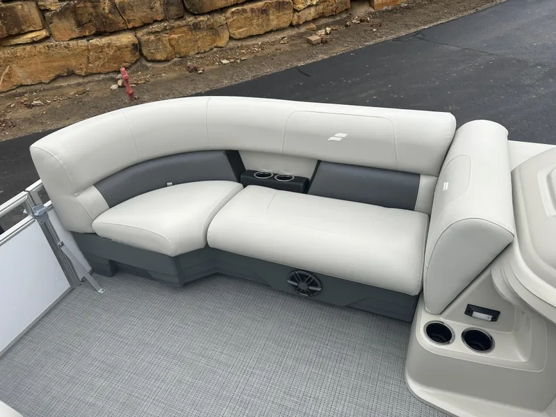 Slide: The Image of 2024 Starcraft LX 20 CB boat interior with gray seating and cup holders. - 16