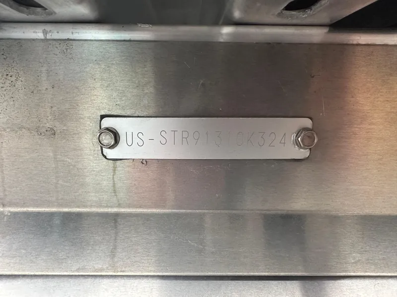 Slide: The Image of 2024 Starcraft LX 20 CB metal identification plate with serial number. - 17