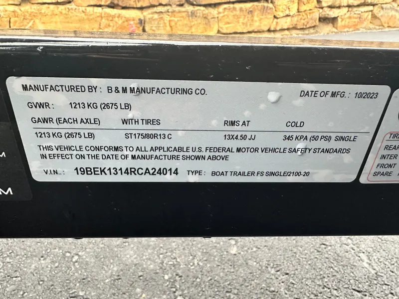 Slide: The Image of 2024 Starcraft LX 20 CB trailer label, showing weight and tire specifications. - 19