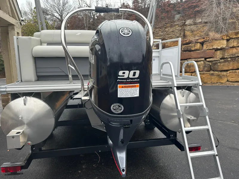 Slide: The Image of 2024 Starcraft LX 20 CB pontoon boat with Yamaha 90 horsepower engine. - 5