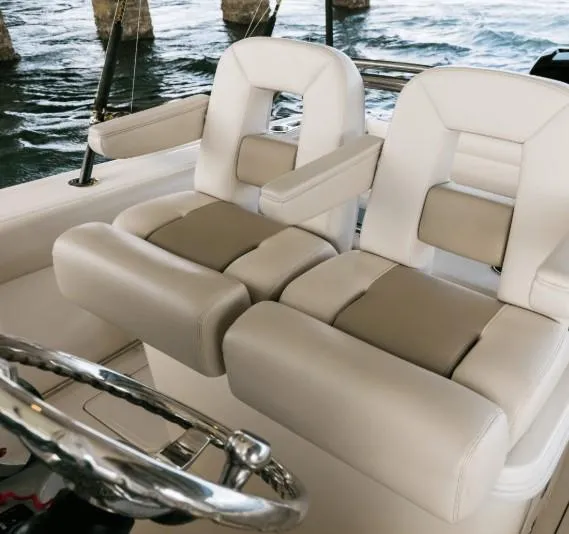 Slide: The Image of Luxury seating on 2021 Boston Whaler 250 Outrage boat, featuring plush beige upholstery. - 12