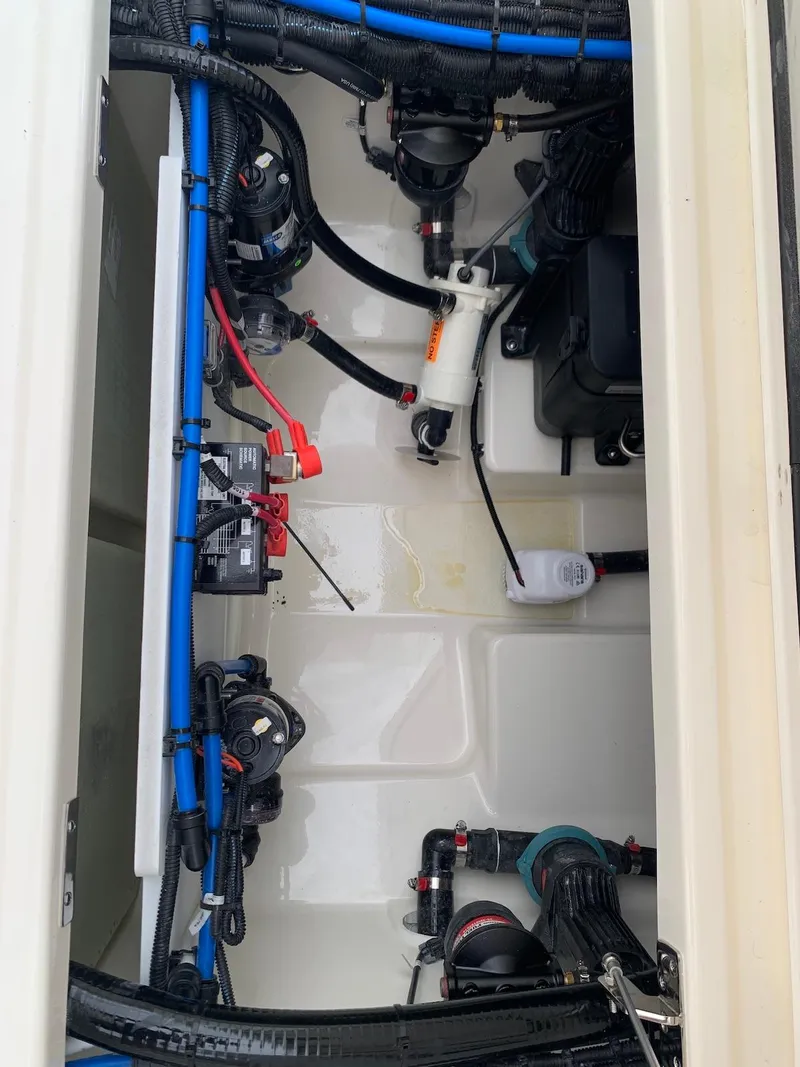 Slide: The Image of 2021 Boston Whaler 250 Outrage boat wiring and plumbing system. - 24