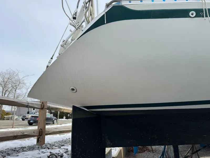 Slide: The Image of 1984 Canadian Sailcraft 36 sailboat on dry dock, showcasing hull design. - 11