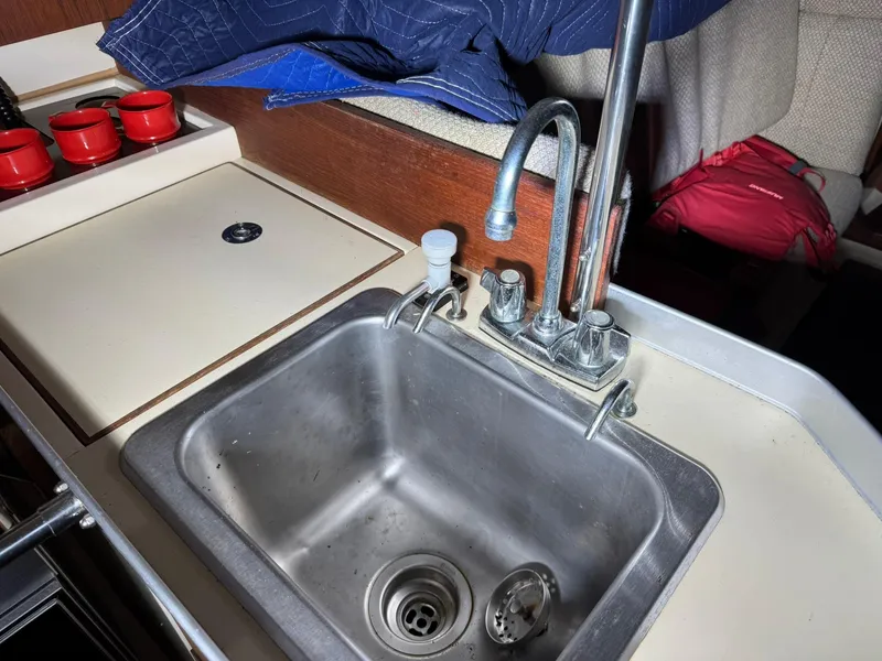 Slide: The Image of Galley sink in 1984 Canadian Sailcraft 36 yacht with faucet and countertop. - 16