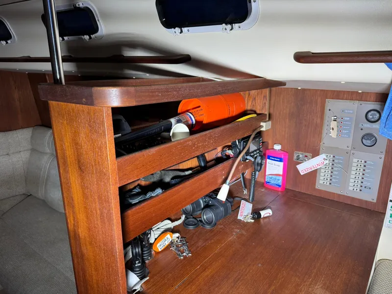 Slide: The Image of Interior of 1984 Canadian Sailcraft 36 sailboat with wooden shelves and electrical panel. - 21