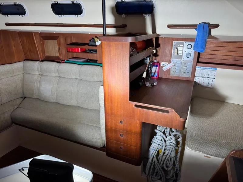 Slide: The Image of Interior of 1984 Canadian Sailcraft 36 sailboat with wood paneling and seating area. - 22