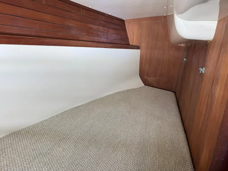 Slide: The Image of Interior cabin of 1984 Canadian Sailcraft 36 sailboat with wood paneling and carpeted floor. - 23
