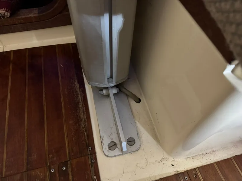 Slide: The Image of 1984 Canadian Sailcraft 36 interior detail with wooden flooring and metal fixture. - 25