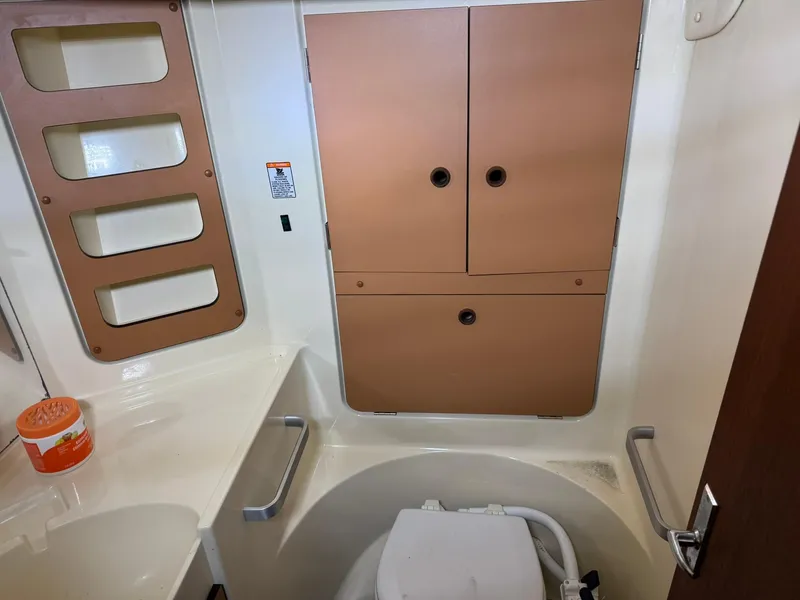 Slide: The Image of 1984 Canadian Sailcraft 36 yacht bathroom with storage cabinets and toilet. - 29