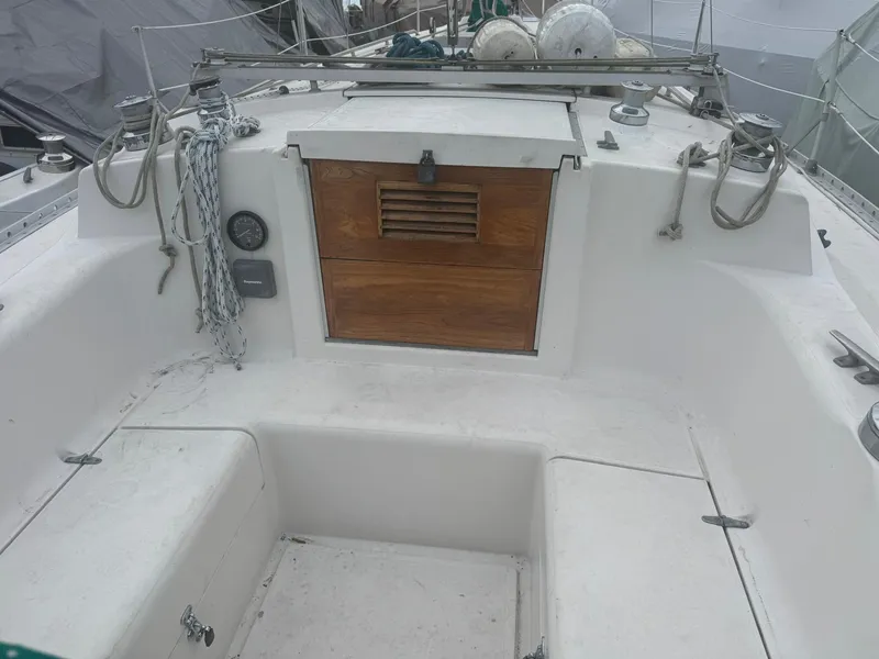 Slide: The Image of 1984 Canadian Sailcraft 36 sailboat cockpit with wooden hatch and rigging. - 41