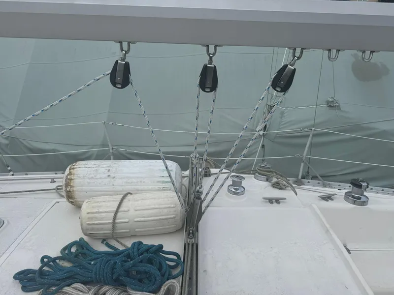 Slide: The Image of 1984 Canadian Sailcraft 36 deck with ropes, fenders, and rigging details. - 44