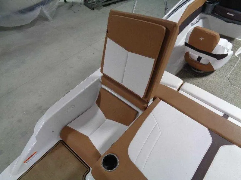 Slide: The Image of 2017 Four Winns Horizon 190 boat interior with brown and white seating. - 10