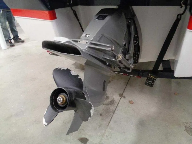 Slide: The Image of Damaged propeller of a 2017 Four Winns Horizon 190 boat in a garage. - 13