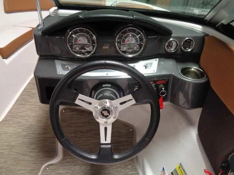 Slide: The Image of 2017 Four Winns Horizon 190 dashboard with steering wheel and instrument panel. - 20