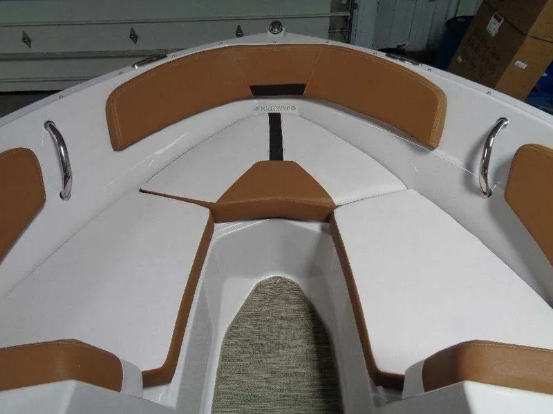 Slide: The Image of 2017 Four Winns Horizon 190 boat interior with brown and white seating. - 5