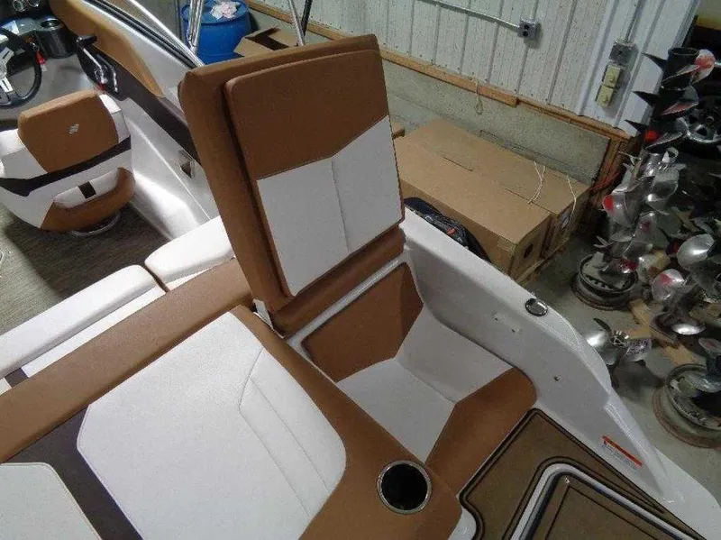Slide: The Image of 2017 Four Winns Horizon 190 boat interior with brown and white seating. - 8