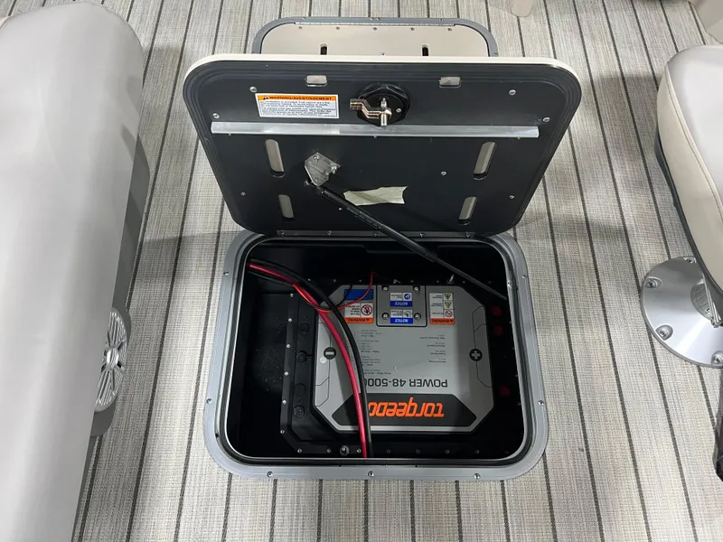 Slide: The Image of 2023 Princecraft Brio Electric 170 battery compartment with Power RB 3000 battery. - 11