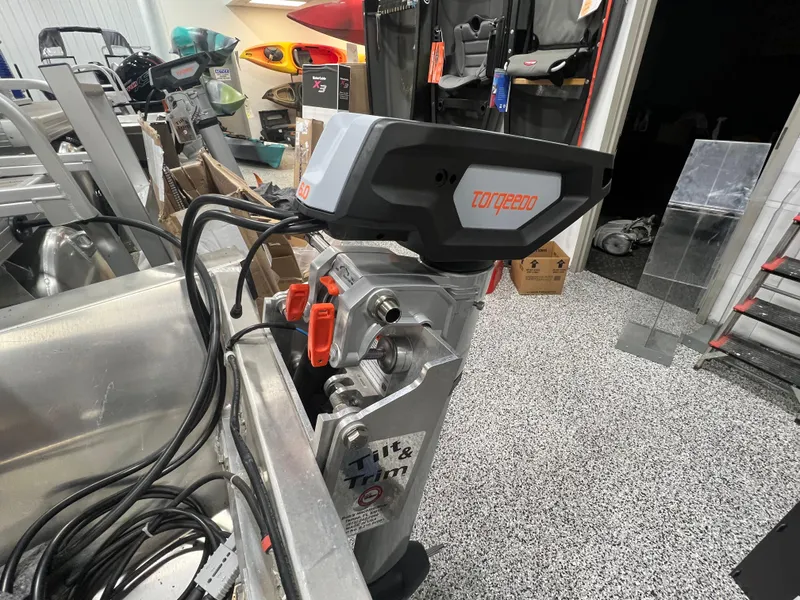 Slide: The Image of 2023 Princecraft Brio Electric 170 boat with Torqeedo motor in a showroom. - 17