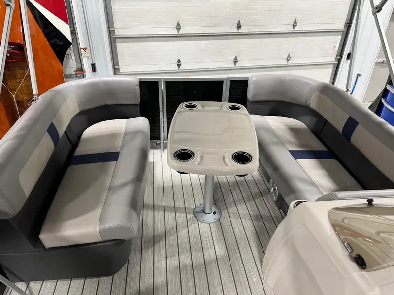 Slide: The Image of 2023 Princecraft Brio Electric 170 interior with cushioned seating and table. - 4