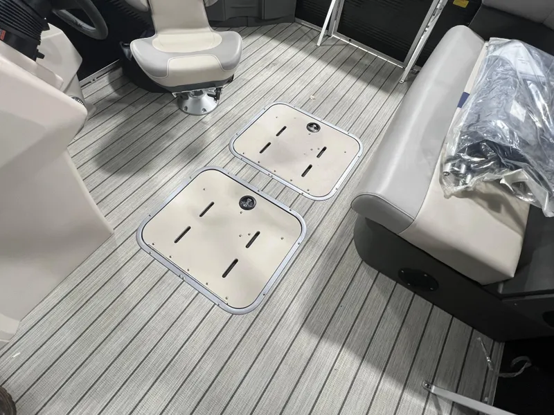 Slide: The Image of 2023 Princecraft Brio Electric 170 interior with seating and storage compartments. - 9