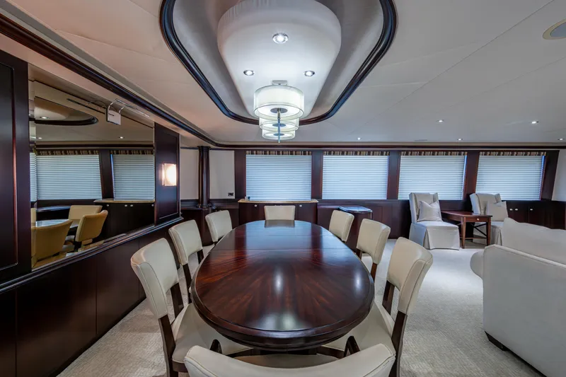 Slide: The Image of Luxurious dining area on a 2002 Westport 112 yacht, featuring elegant furnishings and ambient lighting. - 20