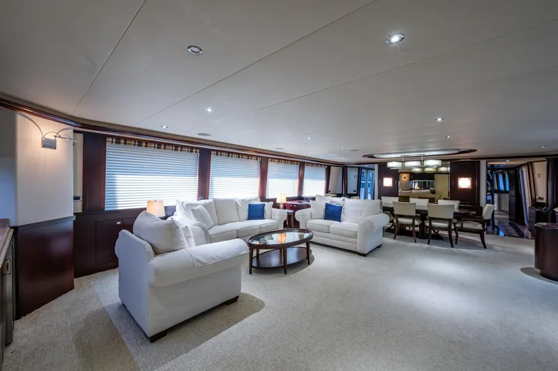 Slide: The Image of Luxurious interior of 2002 Westport 112 yacht with elegant seating and dining area. - 21
