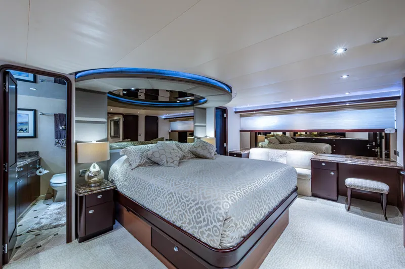 Slide: The Image of Luxurious bedroom interior of 2002 Westport 112 yacht with modern decor and ambient lighting. - 26