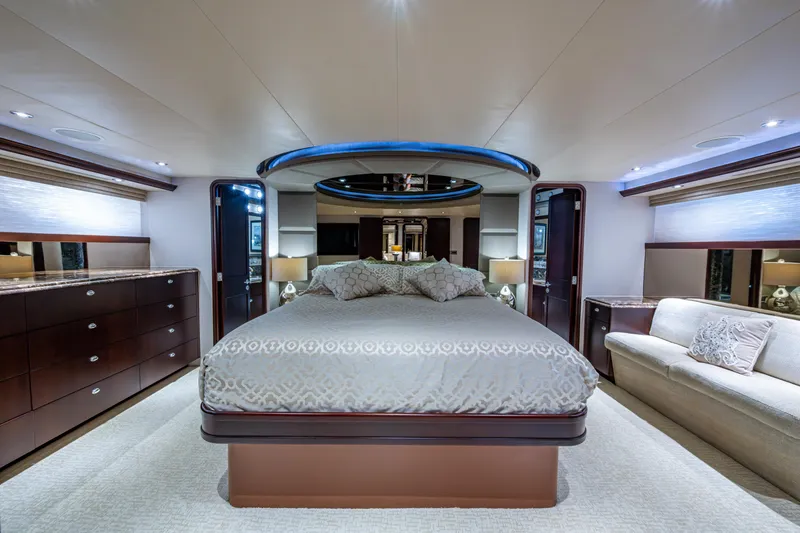 Slide: The Image of Luxurious bedroom interior of 2002 Westport 112 yacht with elegant furnishings and ambient lighting. - 27