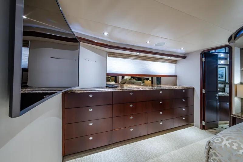 Slide: The Image of Luxurious interior of 2002 Westport 112 yacht with elegant wood cabinetry and modern lighting. - 28