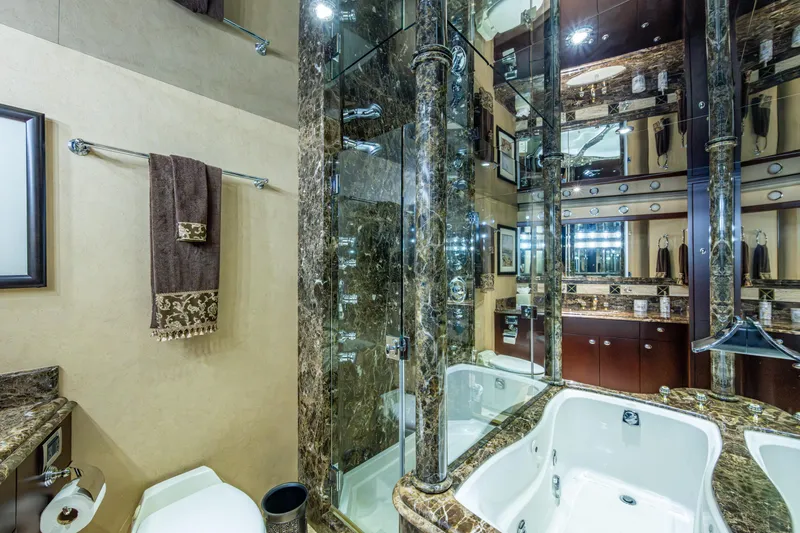 Slide: The Image of Luxurious bathroom with marble accents in a 2002 Westport 112 yacht. - 29