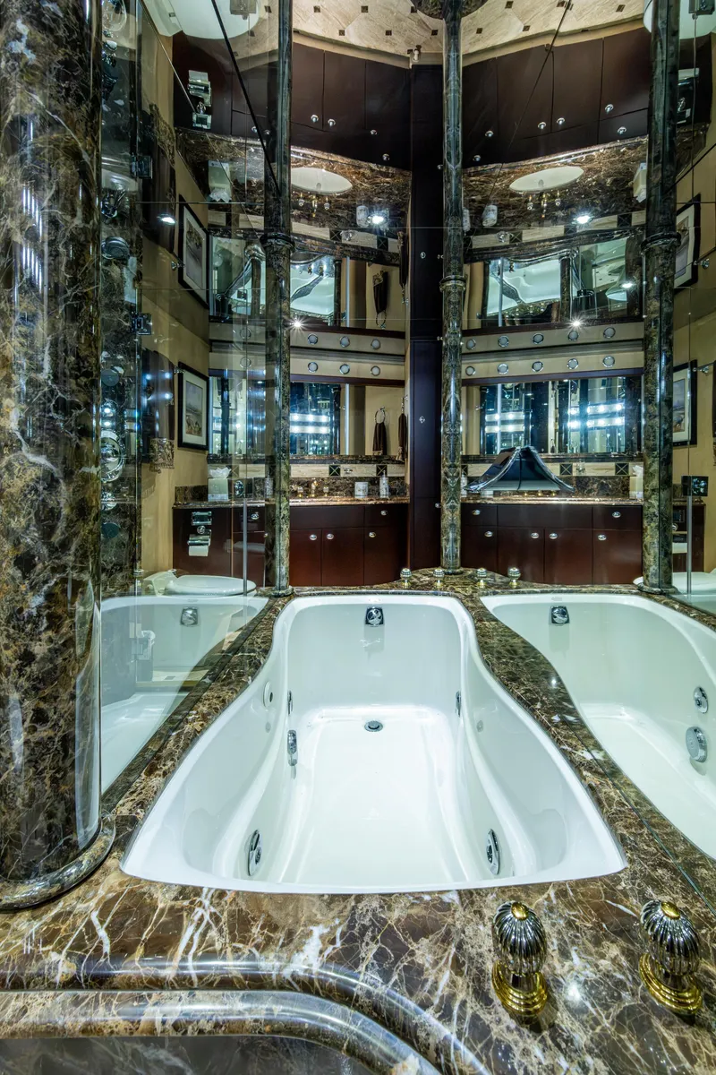 Slide: The Image of Luxurious marble bathroom with mirrored walls in a 2002 Westport 112 yacht. - 31