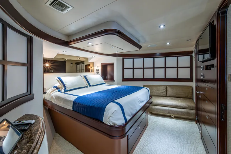 Slide: The Image of Luxurious bedroom interior on a 2002 Westport 112 yacht, featuring elegant furnishings and modern design. - 32