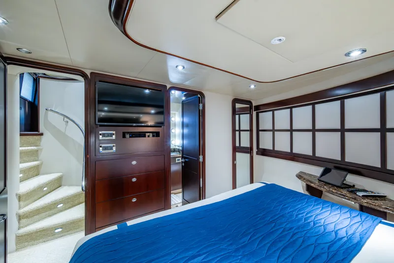 Slide: The Image of Luxurious bedroom interior of 2002 Westport 112 yacht with modern amenities and elegant design. - 35