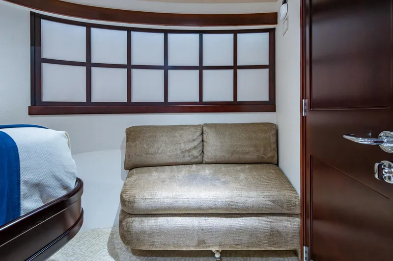 Slide: The Image of Luxurious interior of 2002 Westport 112 yacht with cozy seating and elegant wood finishes. - 36