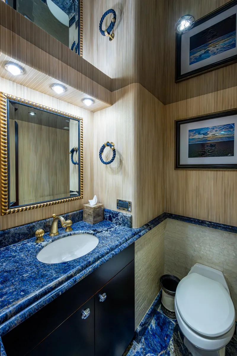 Slide: The Image of Luxurious bathroom in 2002 Westport 112 yacht with blue marble countertop and elegant decor. - 38