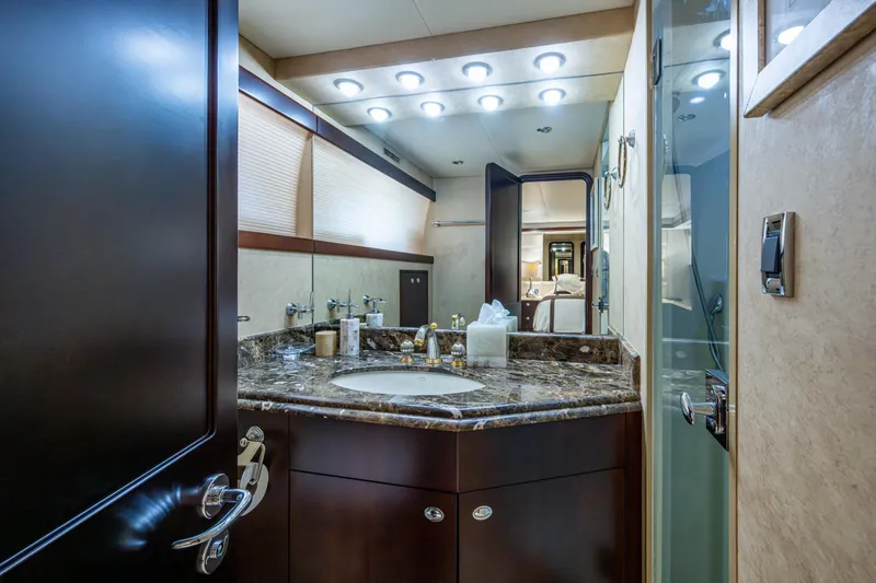 Slide: The Image of Luxurious bathroom interior on a 2002 Westport 112 yacht, featuring elegant fixtures and lighting. - 43
