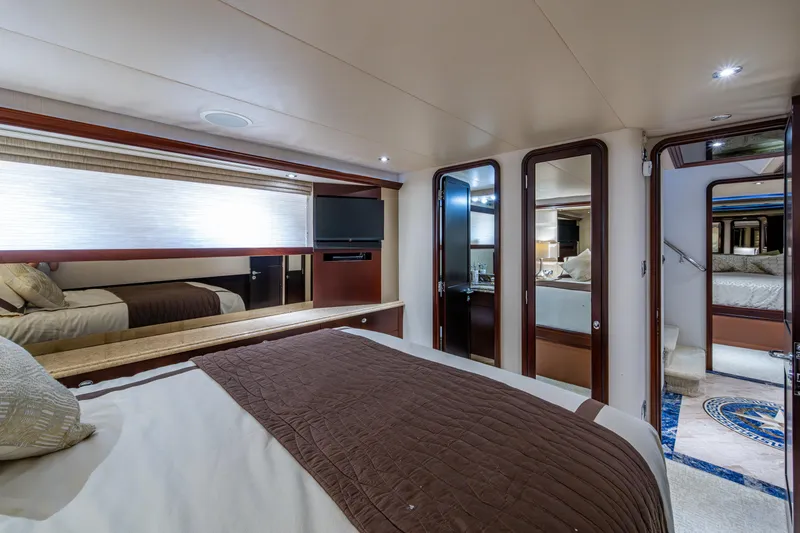 Slide: The Image of Luxurious bedroom interior of 2002 Westport 112 yacht, featuring elegant design and modern amenities. - 44