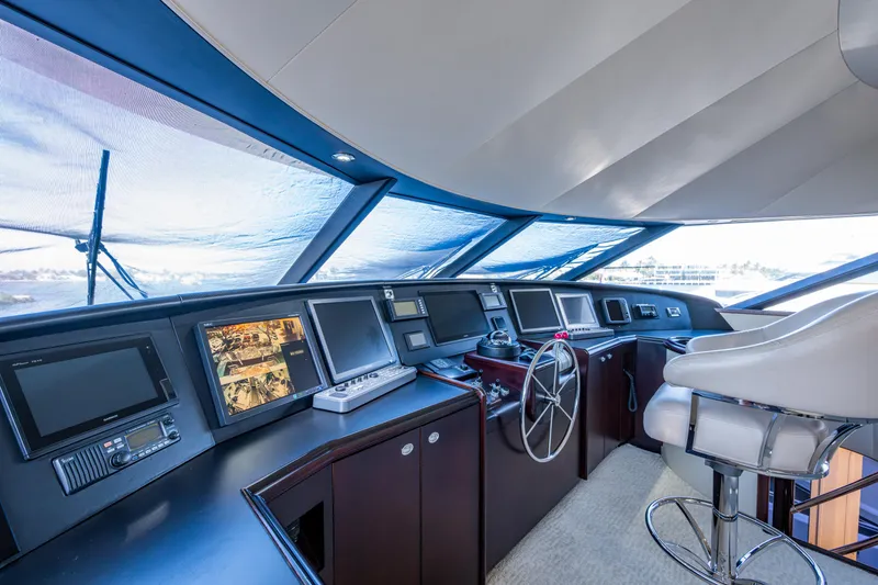 Slide: The Image of Luxurious helm of 2002 Westport 112 yacht with modern navigation equipment. - 49