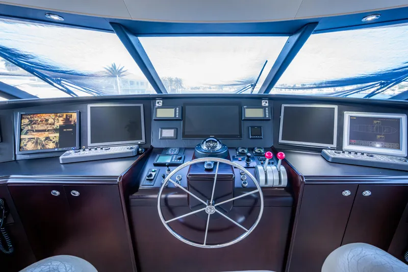 Slide: The Image of Control room of a 2002 Westport 112 yacht with navigation equipment and steering wheel. - 50