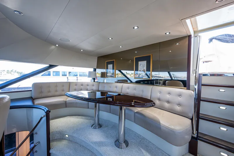 Slide: The Image of Luxurious interior of 2002 Westport 112 yacht with elegant seating and table. - 51