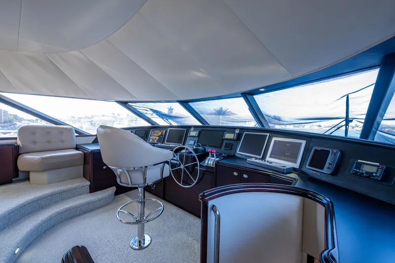 Slide: The Image of Luxurious helm of 2002 Westport 112 yacht with modern navigation equipment. - 52