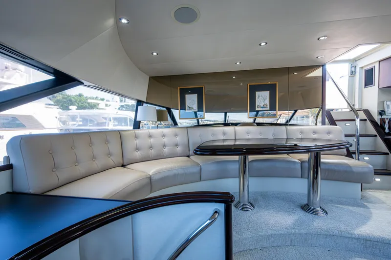 Slide: The Image of Luxurious interior of a 2002 Westport 112 yacht with elegant seating and modern design. - 53