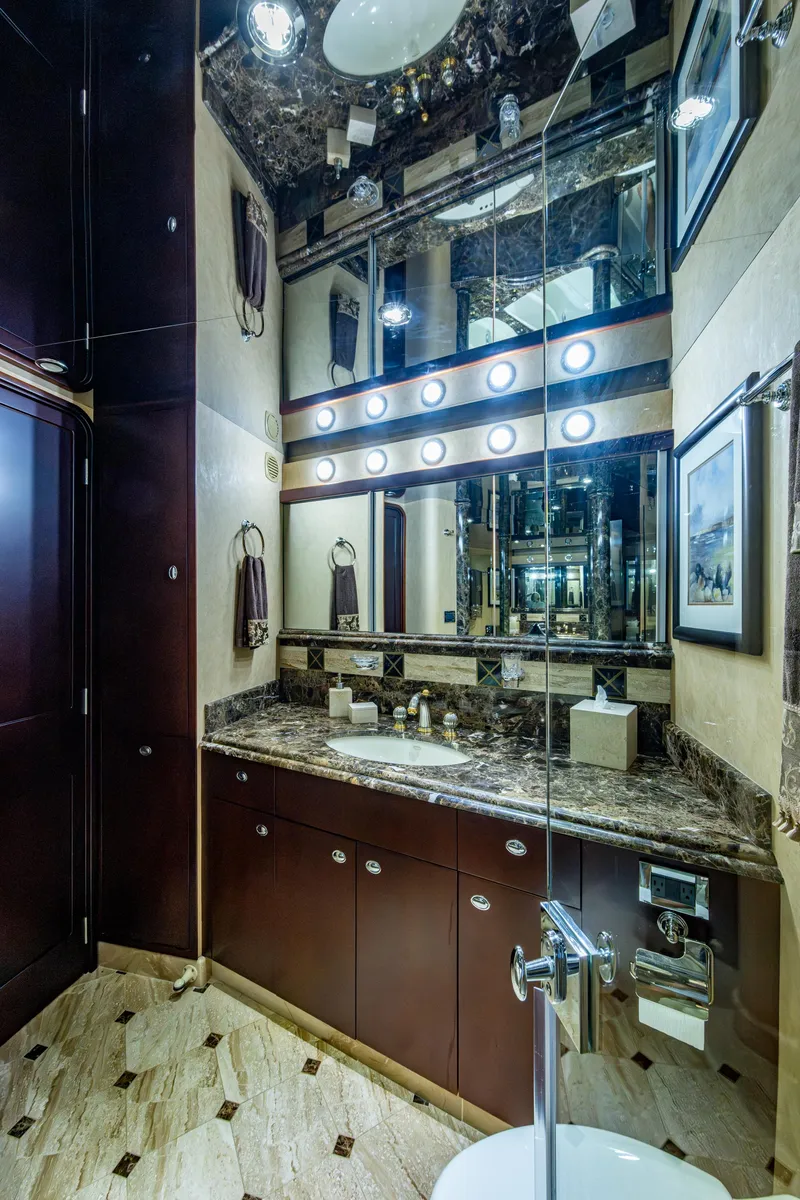 Slide: The Image of Luxurious bathroom in 2002 Westport 112 yacht with marble countertop and mirrored walls. - 55