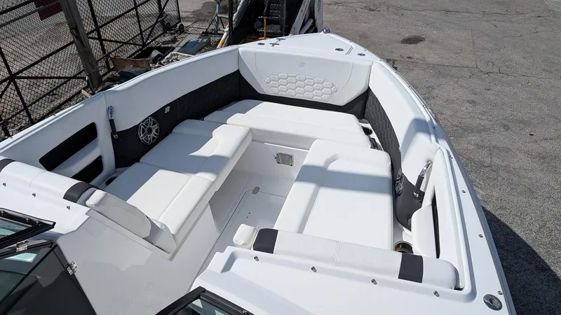 Slide: The Image of 2025 Four Winns H9 OB boat with spacious white seating area. - 17