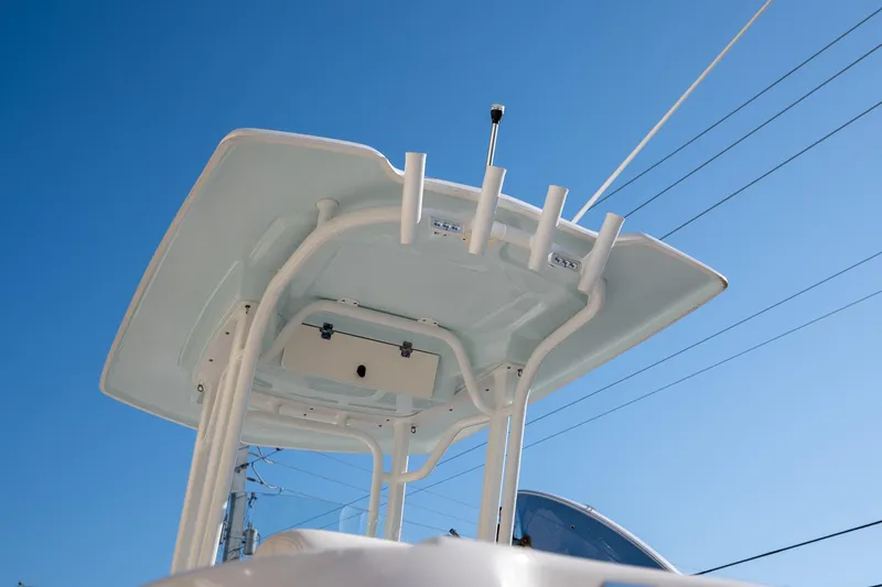 Slide: The Image of 2022 Robalo R242 boat's T-top against clear blue sky. - 19
