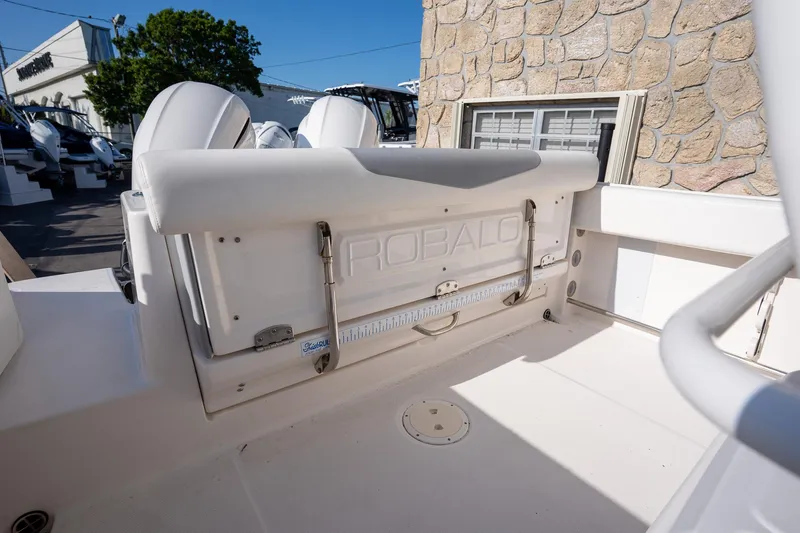 Slide: The Image of 2022 Robalo R242 boat interior with seating and storage, showcasing sleek design. - 26